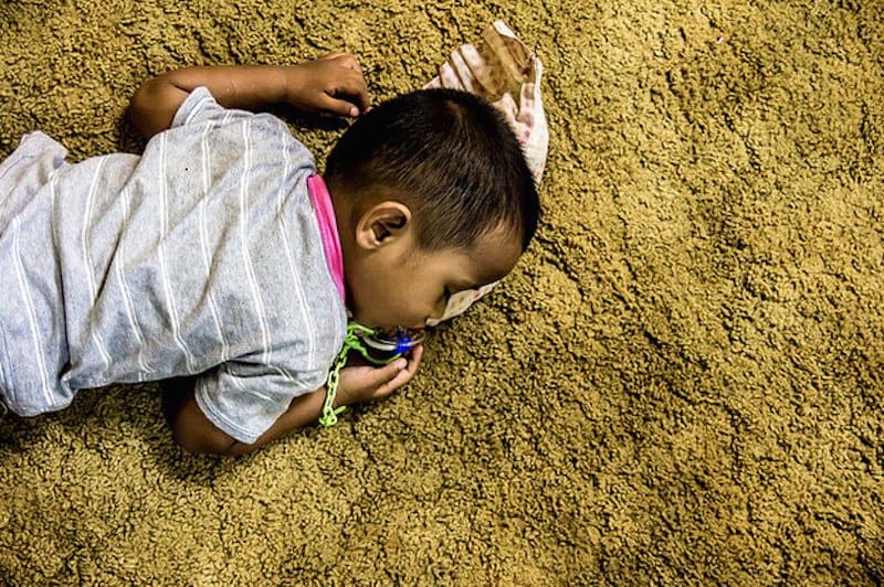 В некоторых местах. Sleeping child on Carpet. Nap on Carpet. Sleeping child on Carpet PNG.